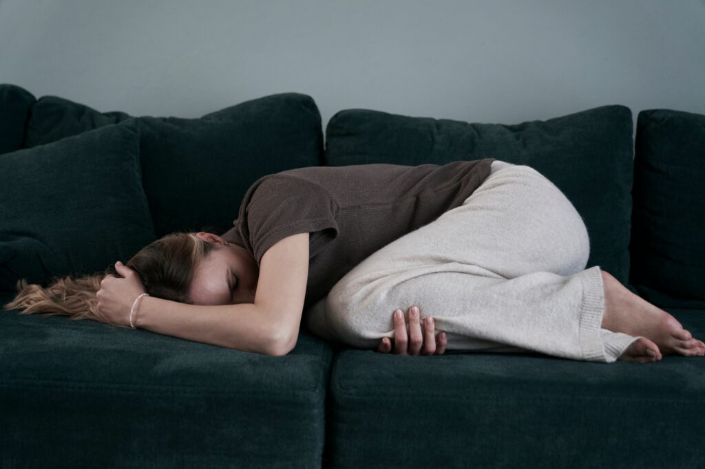 Woman with emotional problems lying on the couch