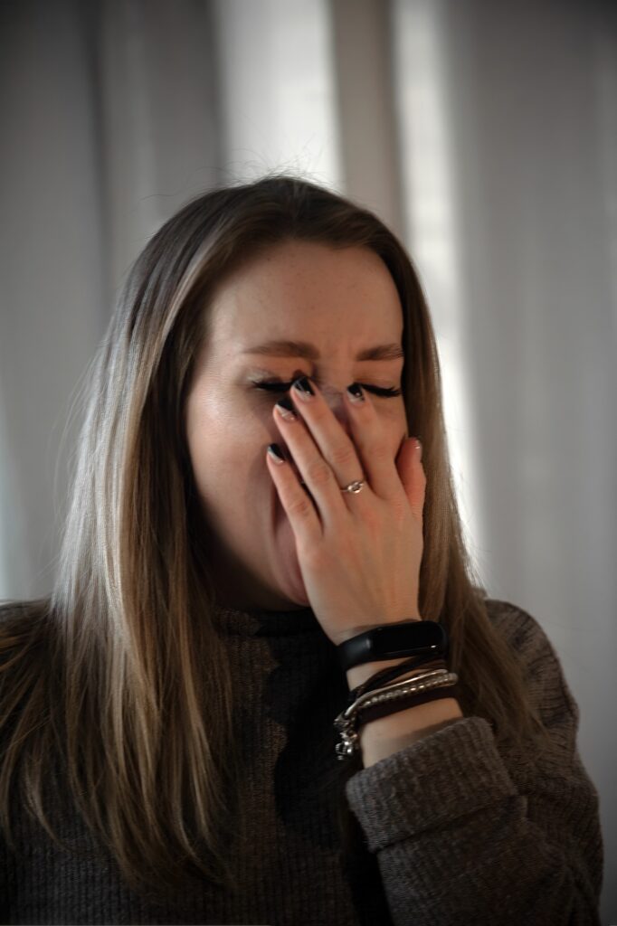 young woman wants to sleep and is tired